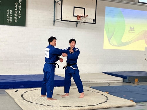 Haga and Nagase demonstrating judo techniques