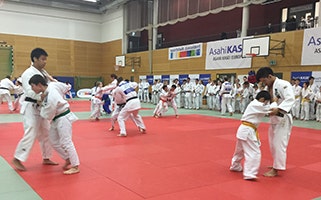 Children practicing with Nagase (left) and Ono (right)