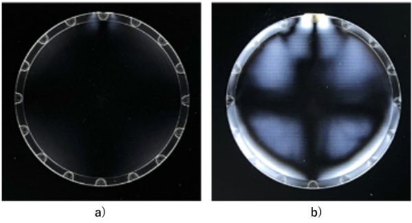 Polarization of lenses injection molded with a) AZP™ and b) cyclic olefin copolymer (COC); white light leakage is observed when polarization is disturbed by birefringence