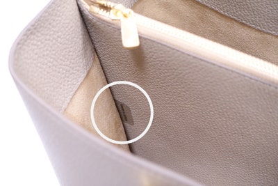 Example of an anti-counterfeit label affixed to a leather bag