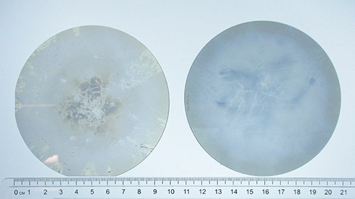 Comparison of Crystal IS 100 mm bulk aluminum nitride substrate from CY24 Q1 (left) with 90% usable area and CY24 Q2 (right) with 99.3% usable area.